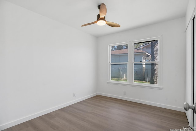 spare room featuring ceiling fan and hardwood / wood-style floors