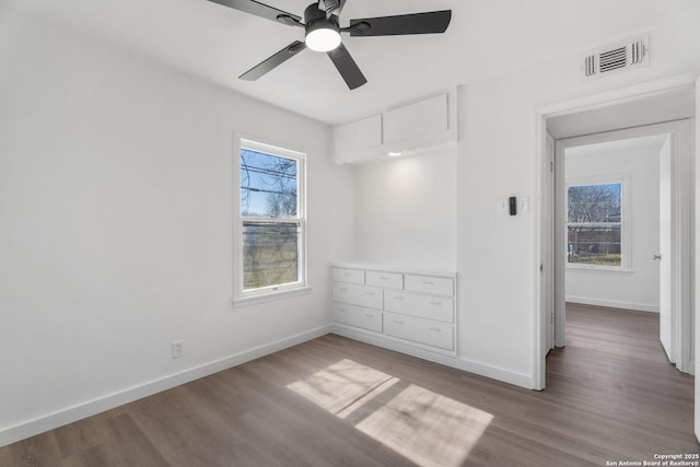 spare room featuring hardwood / wood-style flooring and ceiling fan