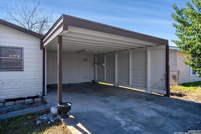 view of parking / parking lot with a carport