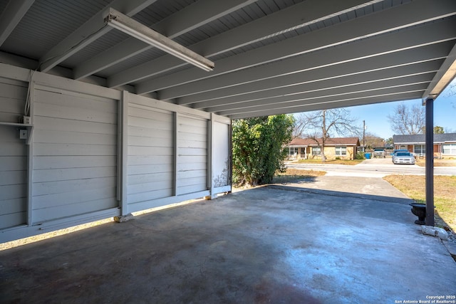 garage featuring a carport