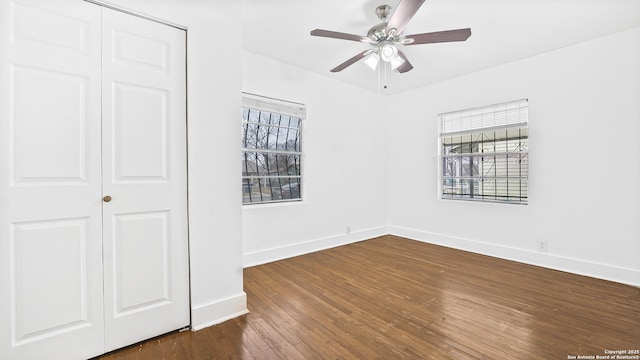 unfurnished bedroom with ceiling fan, hardwood / wood-style floors, and a closet