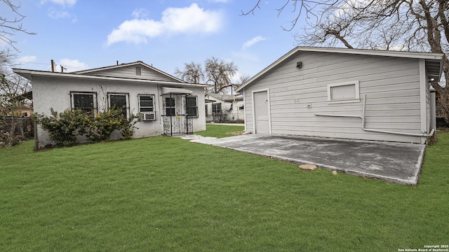 back of house with cooling unit and a yard