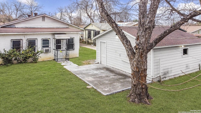 exterior space featuring a yard and cooling unit