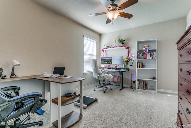 carpeted home office with ceiling fan