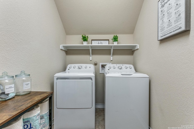 washroom featuring washing machine and clothes dryer