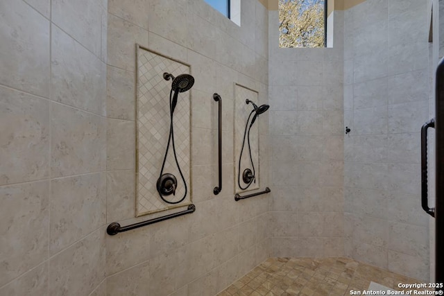 bathroom featuring a tile shower