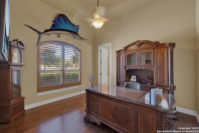 office space with dark wood-type flooring and ceiling fan