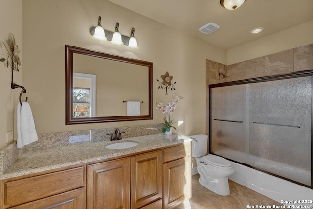 full bathroom with enclosed tub / shower combo, vanity, toilet, and tile patterned floors