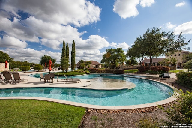 view of swimming pool with a patio area