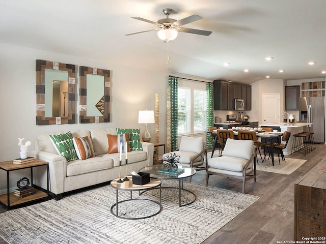 living room with sink, hardwood / wood-style floors, and ceiling fan