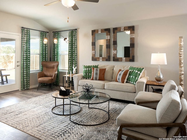 living room featuring hardwood / wood-style flooring, lofted ceiling, and ceiling fan