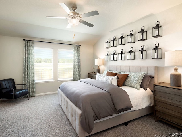 carpeted bedroom featuring vaulted ceiling and ceiling fan