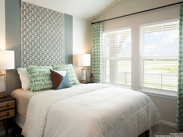 bedroom featuring lofted ceiling