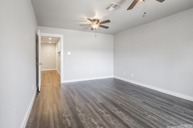 unfurnished room with ceiling fan and dark wood-type flooring