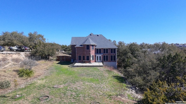 back of property featuring a wooden deck