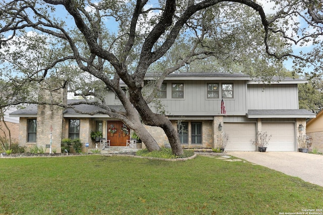 view of front of home with a garage and a front yard