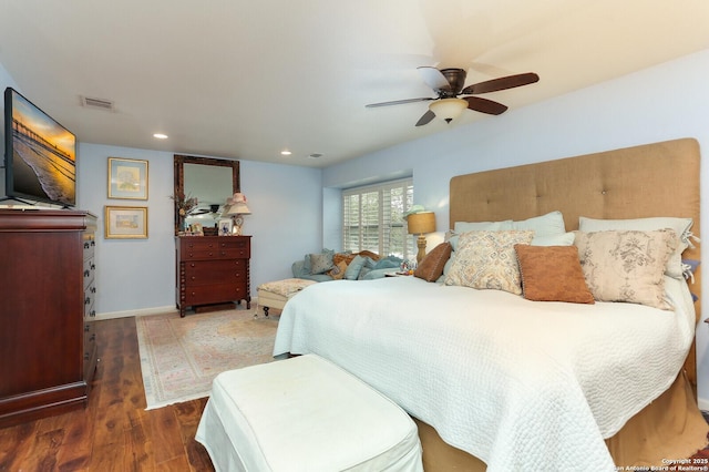 bedroom featuring ceiling fan and dark hardwood / wood-style flooring