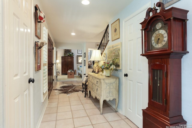 hall with light tile patterned floors