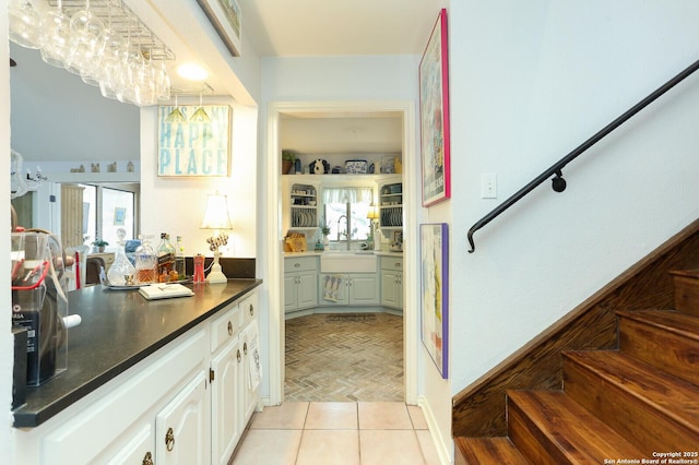 interior space with vanity and tile patterned floors