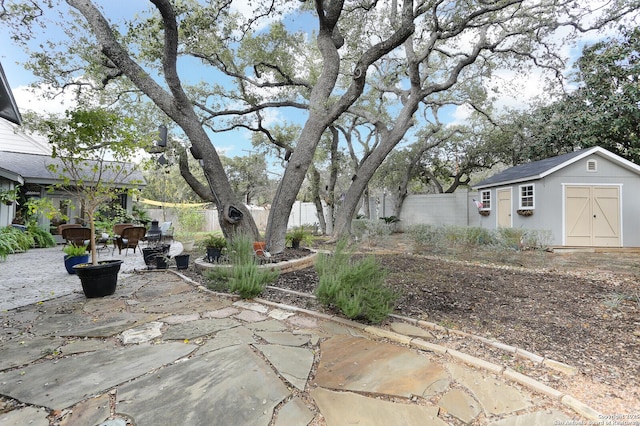 view of patio / terrace featuring a storage unit