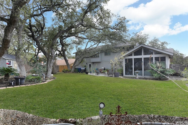 view of yard with a sunroom