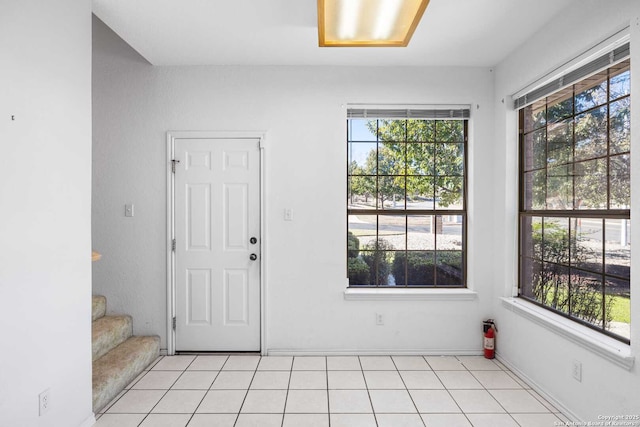 entrance foyer featuring light tile patterned floors