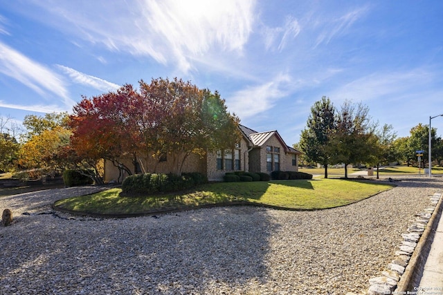 view of property exterior featuring a lawn