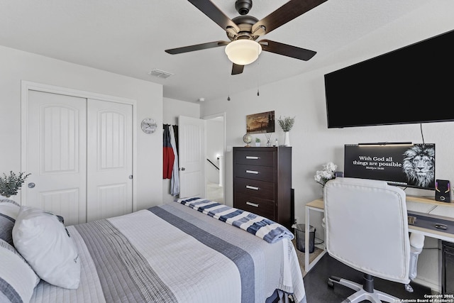 bedroom with ceiling fan and a closet