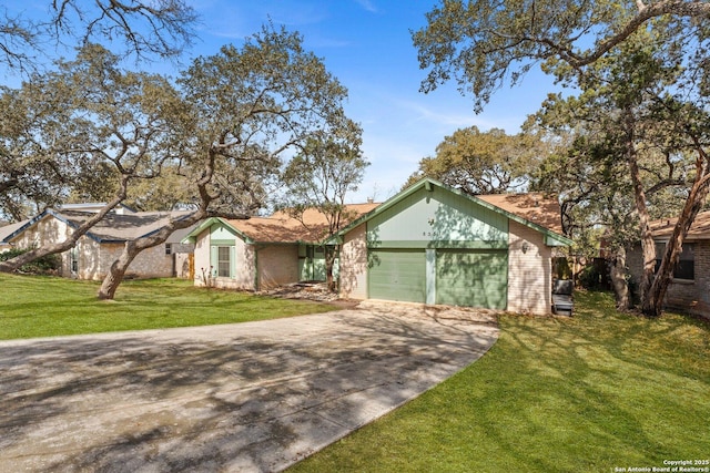 ranch-style house with a garage and a front yard