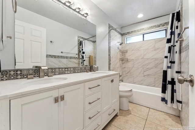 full bathroom featuring tile patterned floors, toilet, vanity, shower / bath combination with curtain, and decorative backsplash