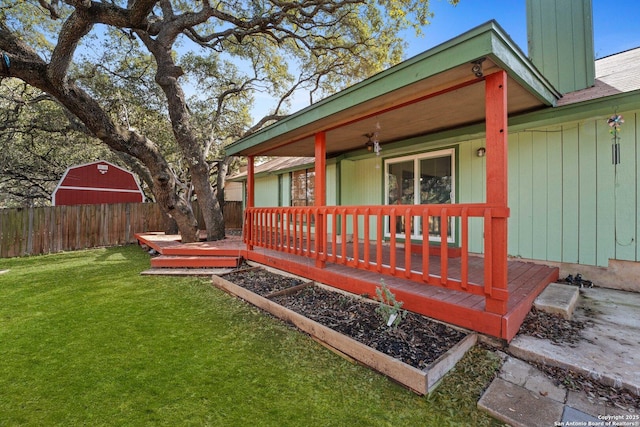 wooden deck featuring a lawn