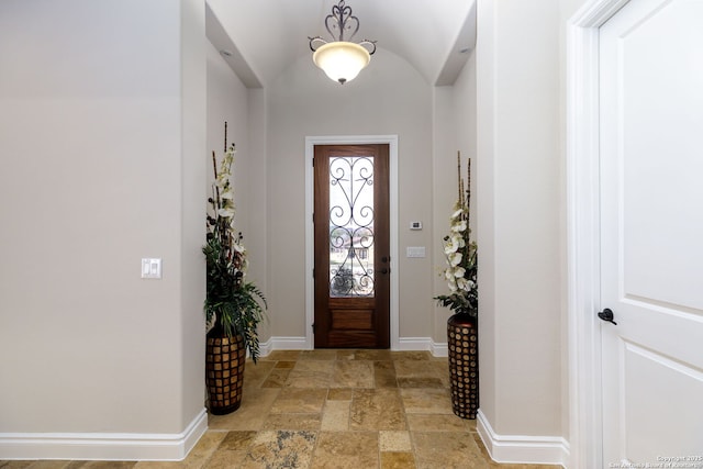 entrance foyer featuring vaulted ceiling