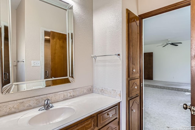 bathroom featuring ceiling fan and vanity