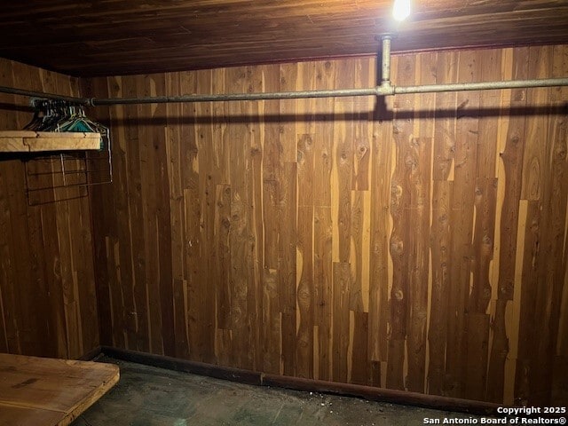 interior space featuring wood walls