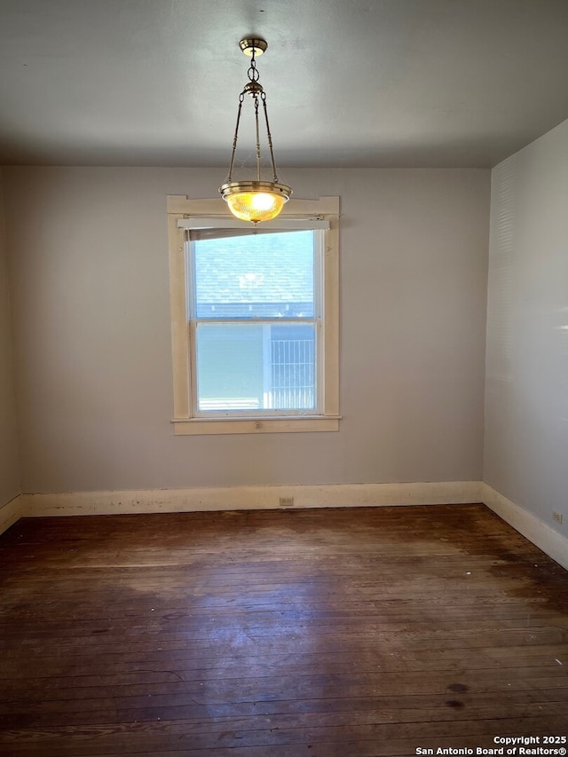 empty room featuring dark wood-type flooring