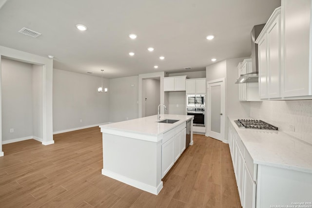211 Ryan Xing, San Antonio, TX 78253 - kitchen with a sink, stainless steel appliances, decorative backsplash, light wood finished floors, and recessed lighting