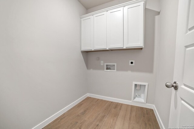 211 Ryan Xing, San Antonio, TX 78253 - laundry area with hookup for an electric dryer, light wood-type flooring, hookup for a washing machine, cabinet space, and baseboards