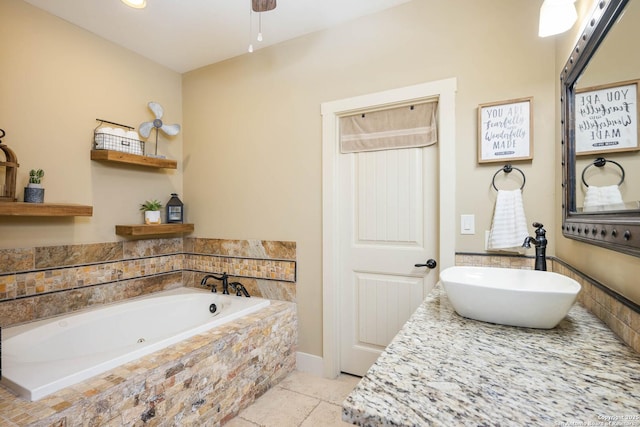 bathroom with a tub, tile patterned flooring, and a sink