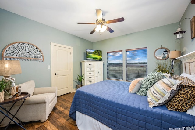 bedroom with ceiling fan and dark wood finished floors