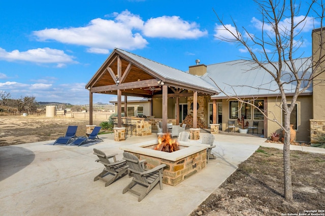 view of patio / terrace with a fire pit