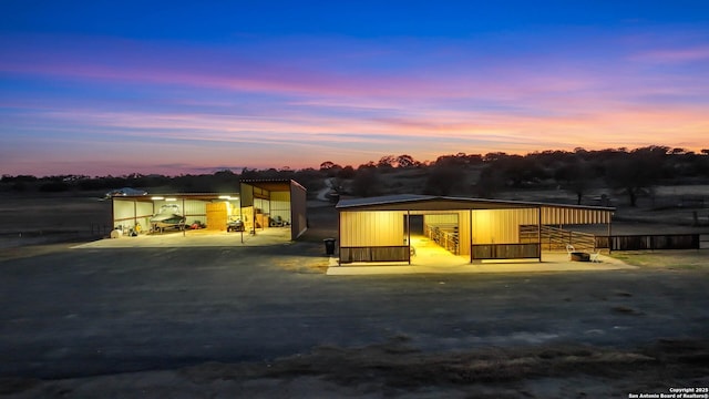 view of front facade featuring an outbuilding and an outdoor structure