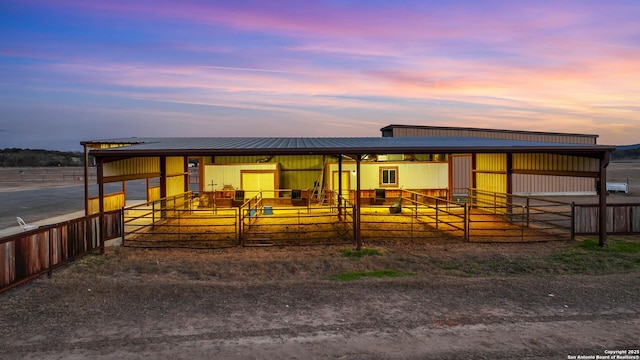 view of front facade featuring an exterior structure and an outdoor structure