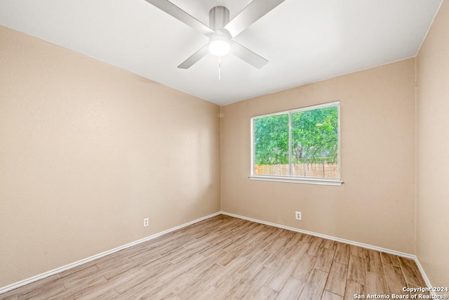 unfurnished room featuring ceiling fan and light wood-type flooring