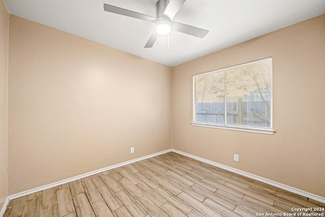 empty room featuring light hardwood / wood-style flooring and ceiling fan