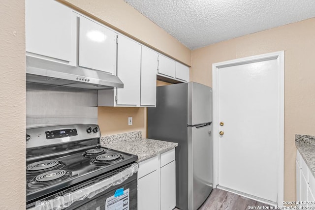 kitchen with white cabinetry, light hardwood / wood-style floors, a textured ceiling, and appliances with stainless steel finishes