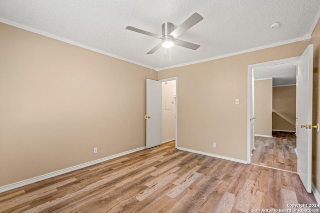 unfurnished bedroom with crown molding, ceiling fan, a textured ceiling, and light hardwood / wood-style floors