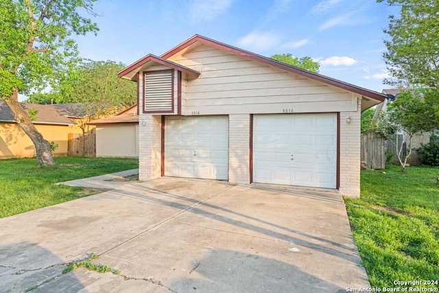 garage featuring a yard