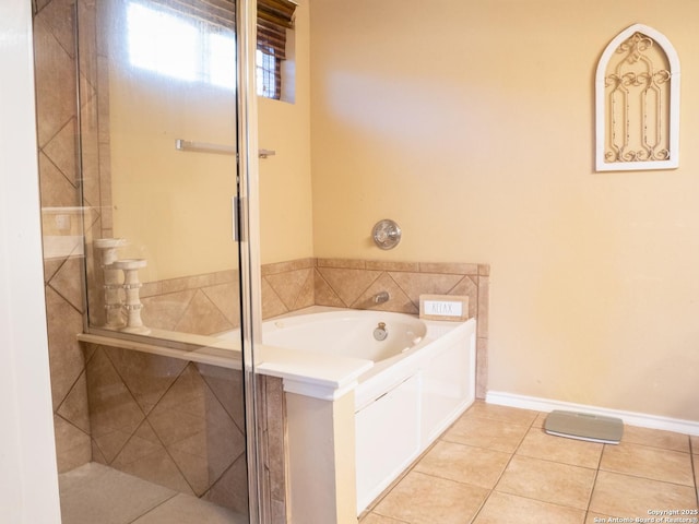 bathroom with tile patterned flooring and a bathing tub