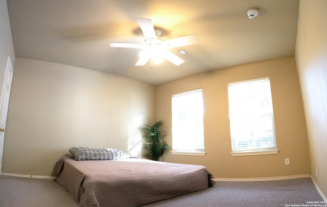 carpeted bedroom with ceiling fan