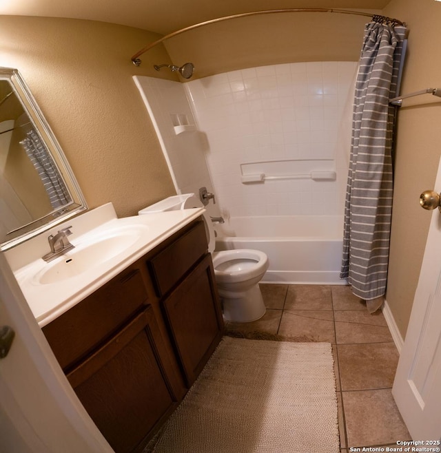 full bathroom with vanity, shower / bath combination with curtain, tile patterned floors, and toilet